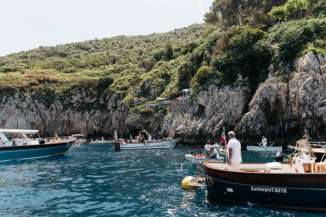 Capri & Blue Grotto Semi Private Boat Day Trip from Sorrento - Coastal sailing you can actually picture: Marina Grande, Roman ruins, and Cascatella