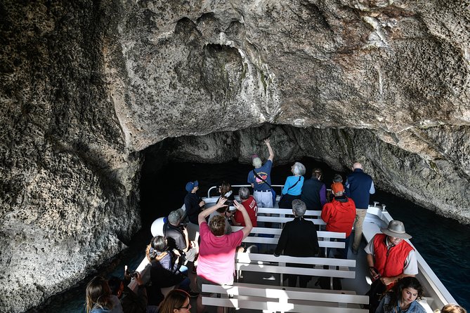 Capri Boat & Land Tour from Sorrento with Limoncello Tasting - Capri highlights from the water: grottos, Malaparte, Punta Carena, Faraglioni