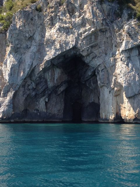 Capri Private Full-Day Boat Tour from Sorrento - Punta Carena Lighthouse and the yacht scene at the waterline