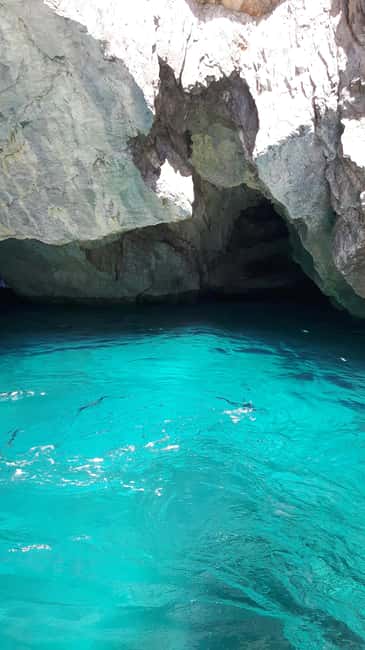 Capri: shared boat tour from Sorrento - 7 hours - Capri from the water: Faraglioni, Tiberius, white caves, and the quick “orientation loop”