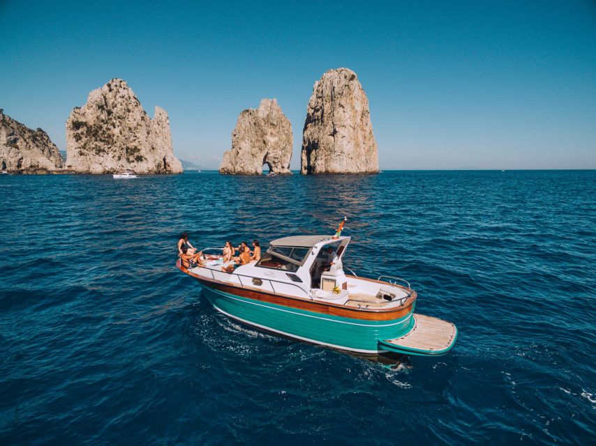 From Sorrento: Capri and Blue Grotto Half-Day Boat Tour - Capri by boat: caves, Faraglioni, and the sights that matter
