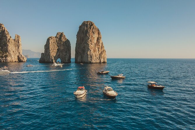 From Sorrento: Capri Small-Group Boat Tour with 4 Hours ashore - Cruise out past Marina Grande, Roman ruins, and the Faraglioni
