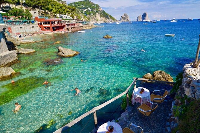 Full Day Private Boat Tour of Capri from Sorrento - Faraglioni rock formations and quick photo timing