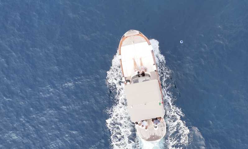 Sorrento: Capri and Blue Grotto Yacht Tour with Snorkeling - Cruising Capri’s coastline: Faraglioni, Marina Piccola, and swim time