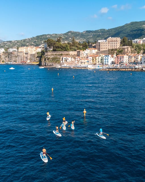Sorrento: SUP Paddleboard Tour to Bagni Regina Giovanna - Paddleboarding from Sorrento toward Roman ruins