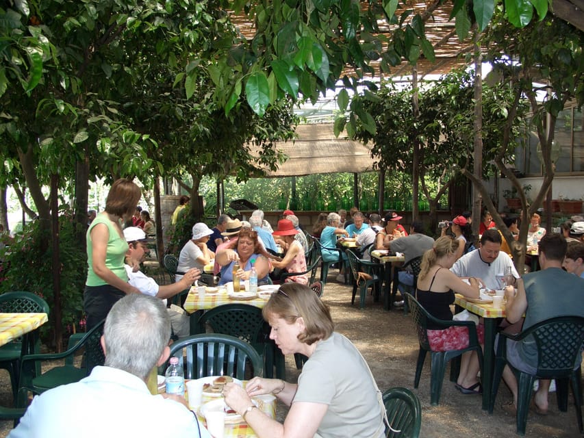 Sorrento: Walking Tour in Lemon Garden w/ Food Tasting - The tasting lineup: olive oil, marmalade, and a serious limoncello set